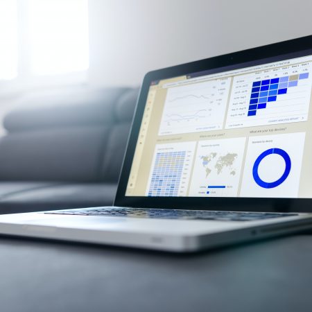 Macbook screen with graphs and statistics